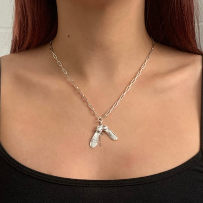 Handmade solid sterling silver double sycamore charm on a recycled silver trace chain necklace from SilverBoo Jewellery in Lincolnshire