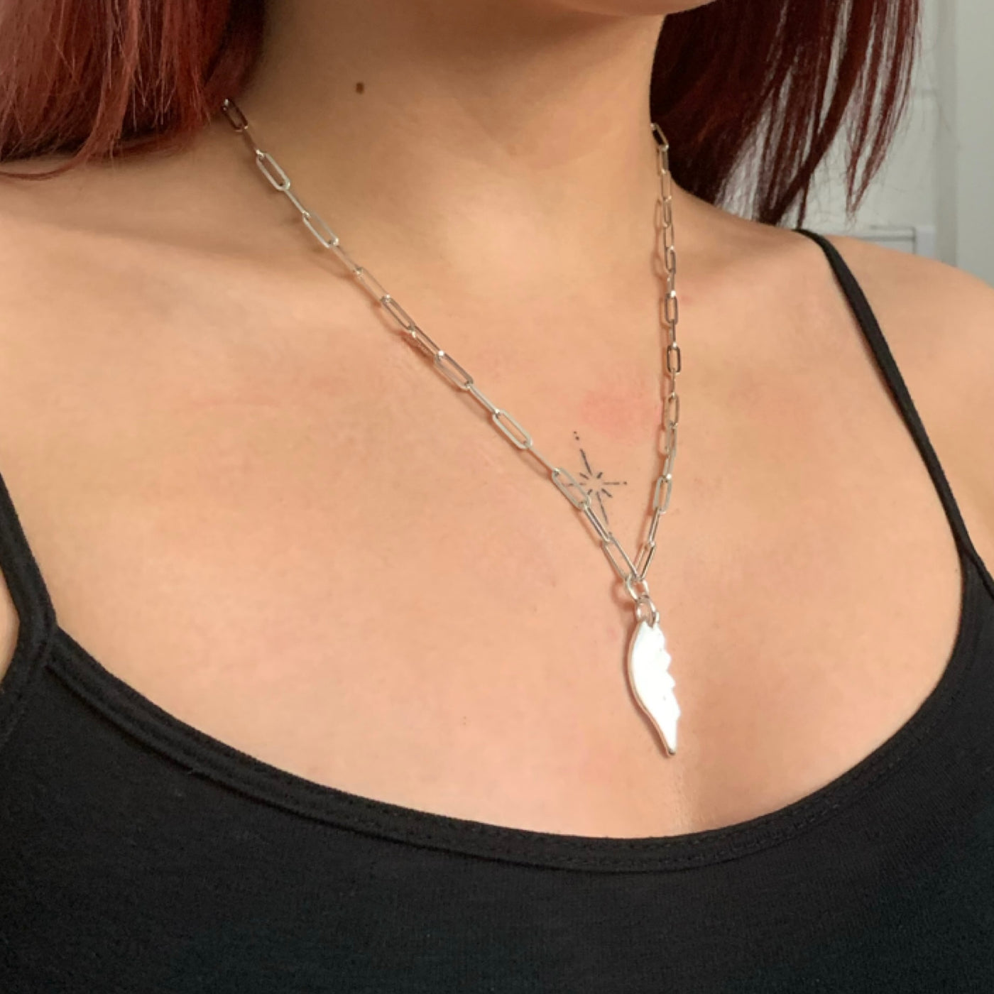 Handmade solid sterling silver chunky angel wing charm on a recycled silver trace chain necklace from SilverBoo Jewellery in Lincolnshire